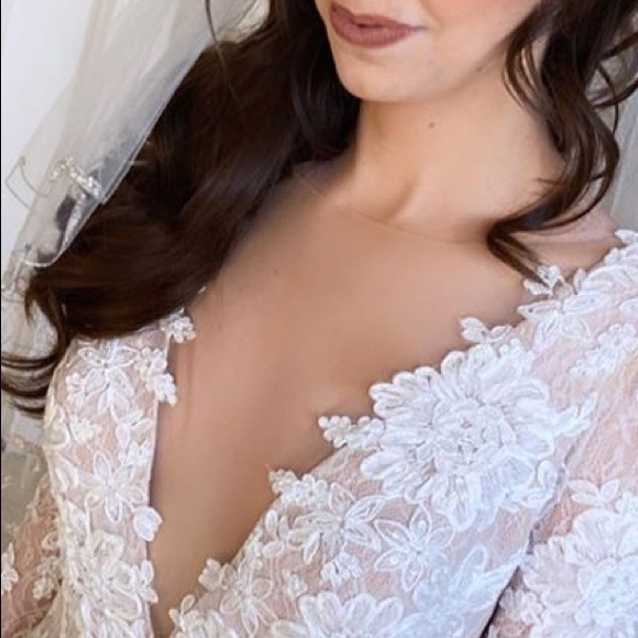 Petite long sleeve plunging v-neckline ivory lace wedding gown
